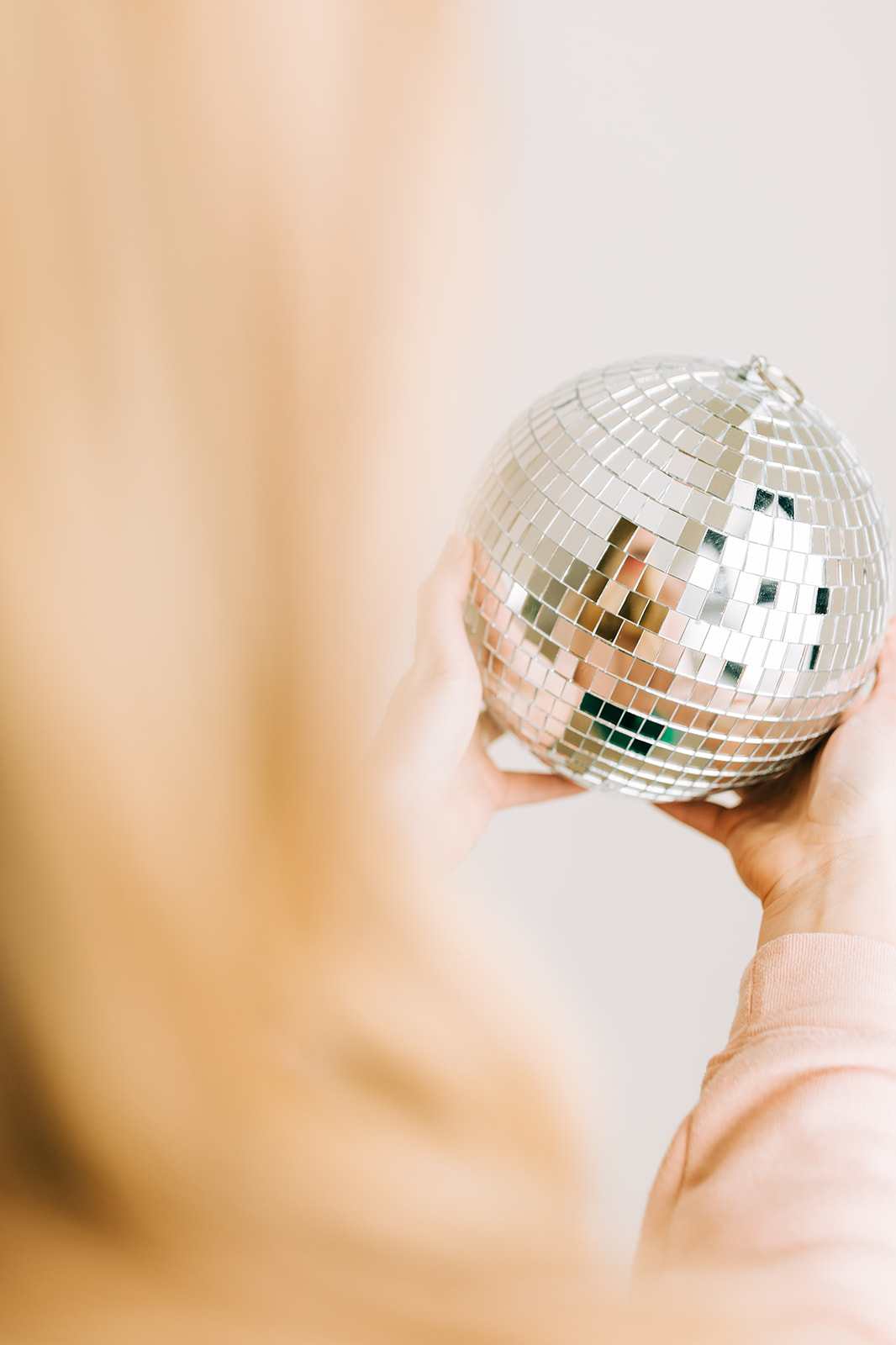 Girl holding disco ball