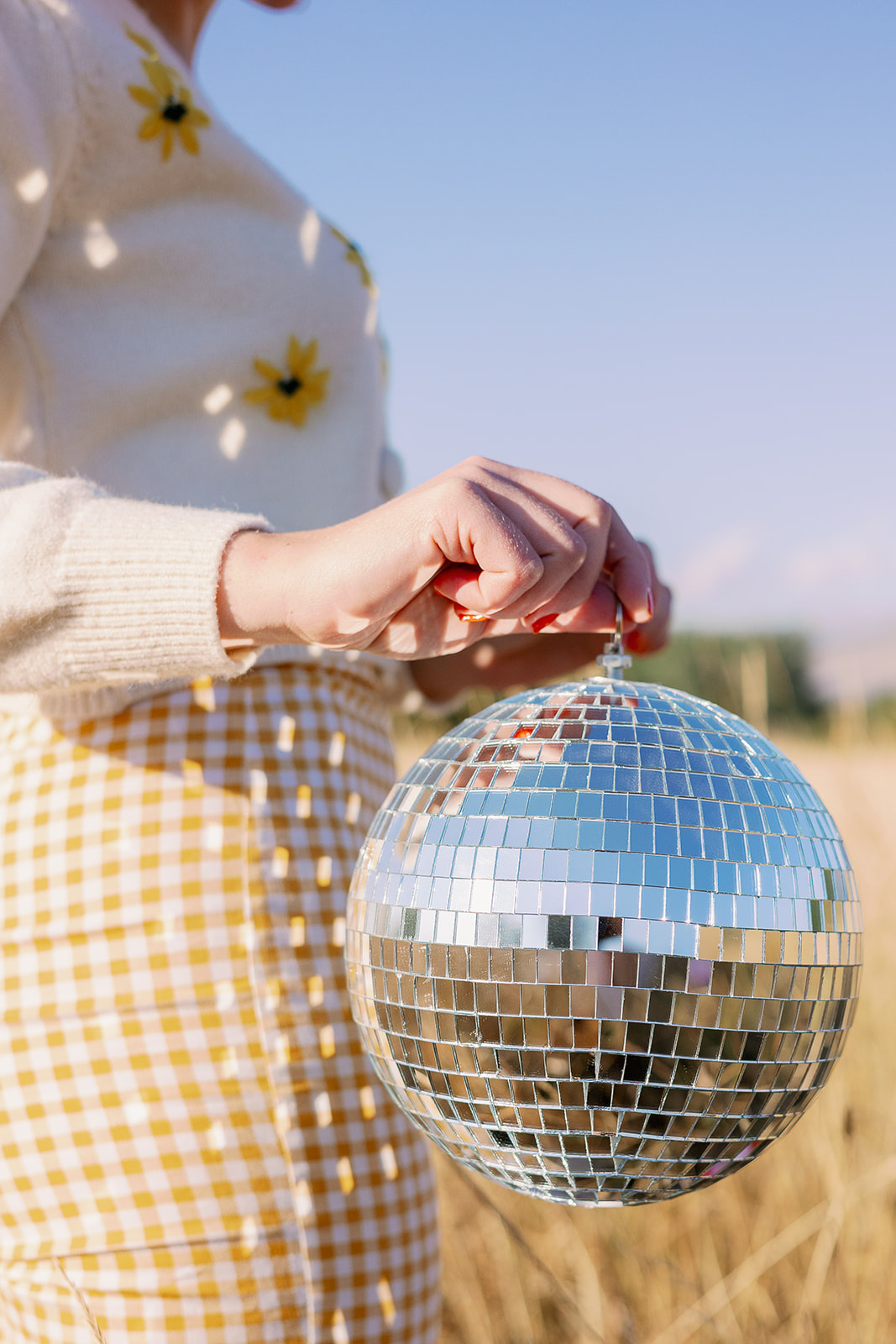 girl holding disco ball